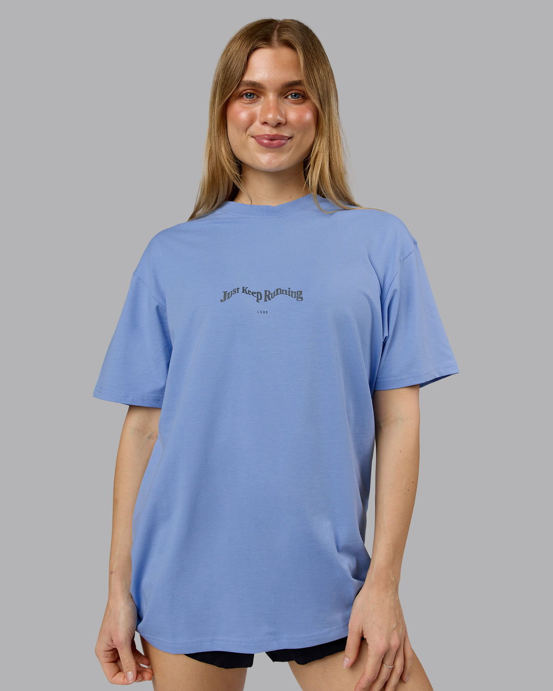 Woman wearing Just Run FLXCotton Oversized Tee - Soft Blue-Dark Storm | Model:Emilie | Size:XS