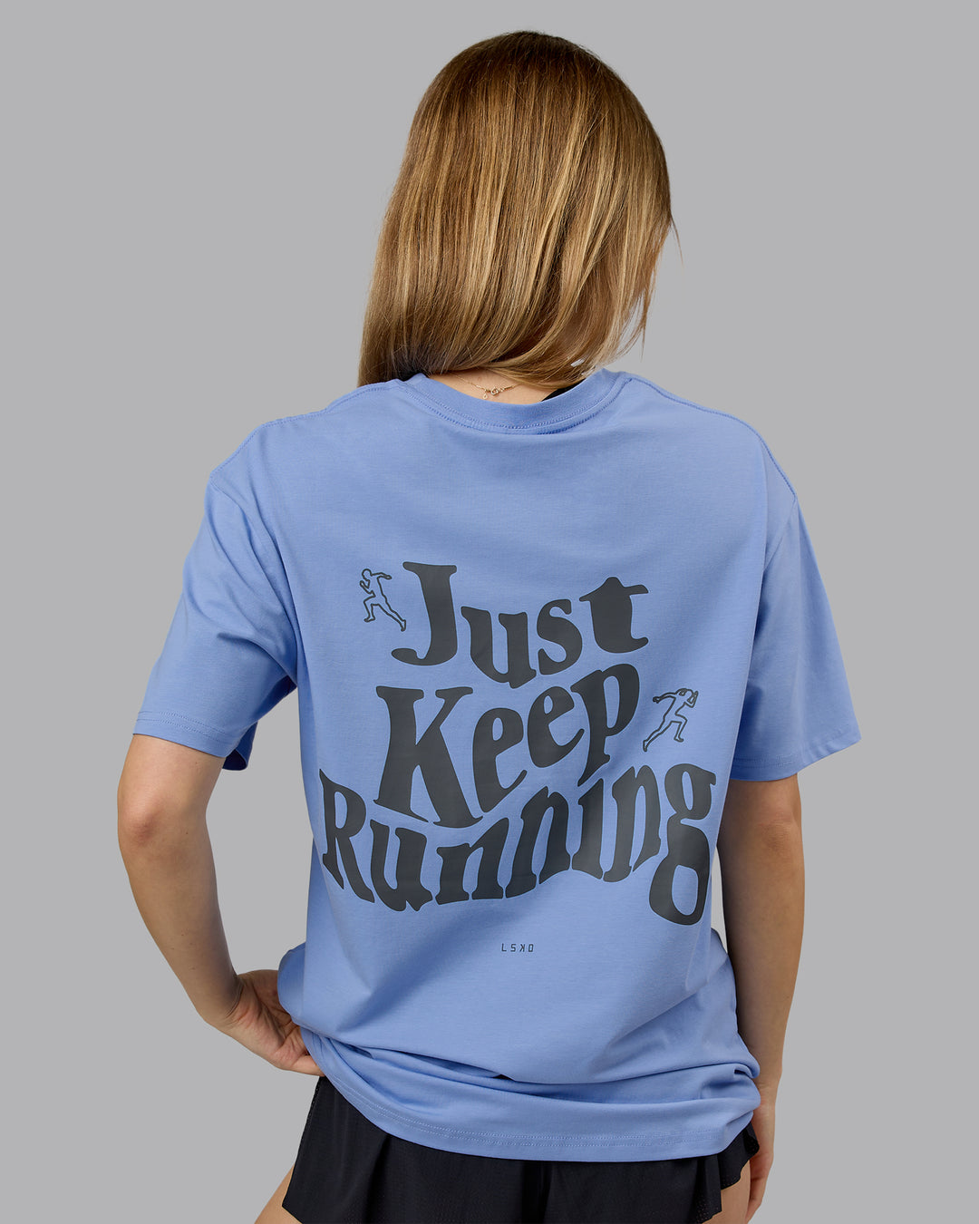 Woman wearing Just Run FLXCotton Oversized Tee - Soft Blue-Dark Storm | Model:Emilie | Size:XS