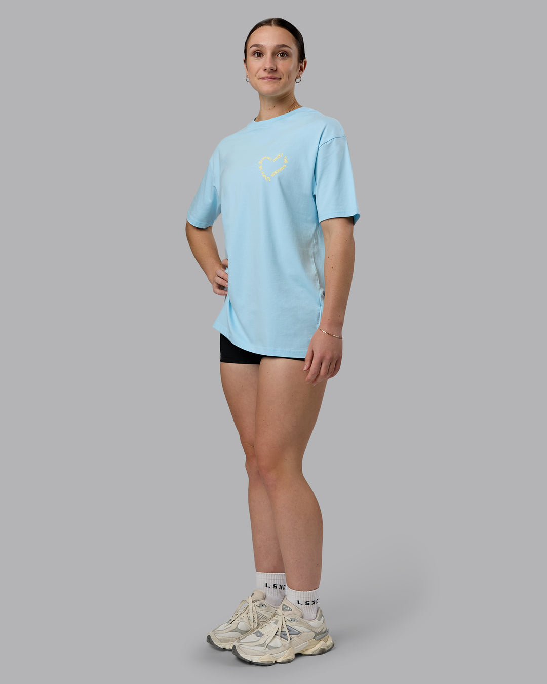 Woman wearing Love The Process FLXCotton Oversize Tee - Crystal Blue-Lemon | Model:Sav | Size:XS