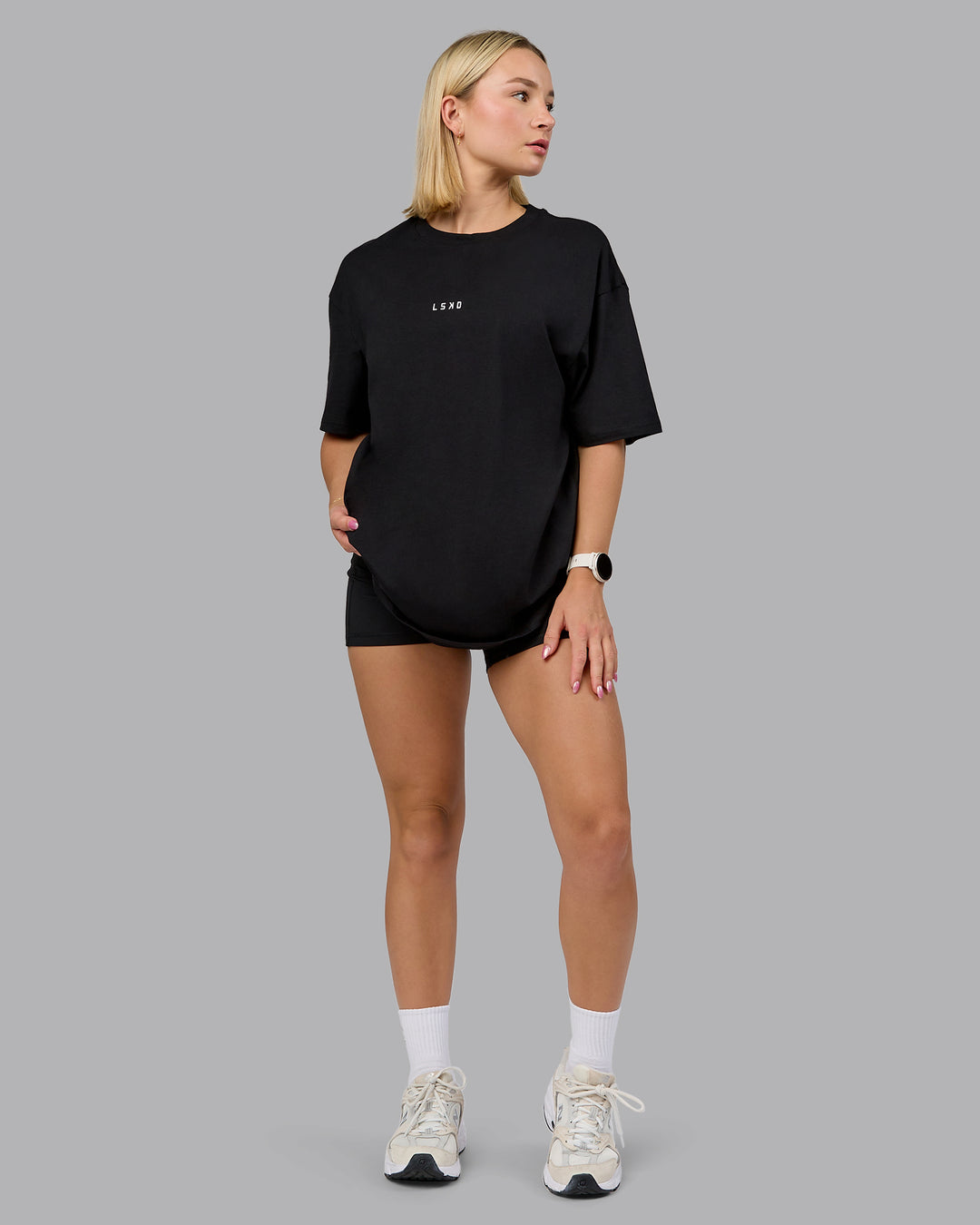 Woman wearing On Repeat FLXCotton Oversized Tee - Black-Mahogany | Model:Halle | Size:XS