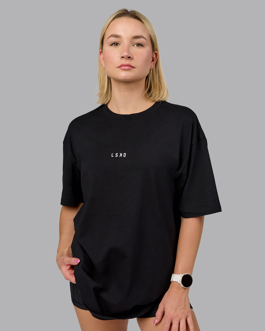 Woman wearing On Repeat FLXCotton Oversized Tee - Black-Mahogany | Model:Halle | Size:XS
