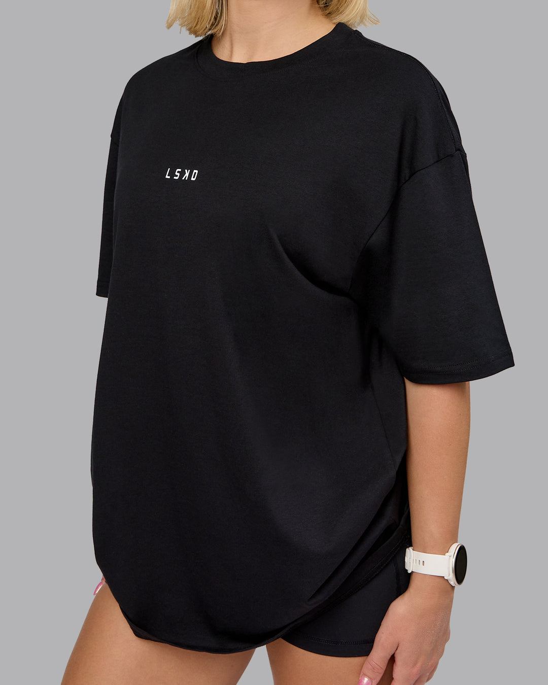 Woman wearing On Repeat FLXCotton Oversized Tee - Black-Mahogany | Model:Halle | Size:XS