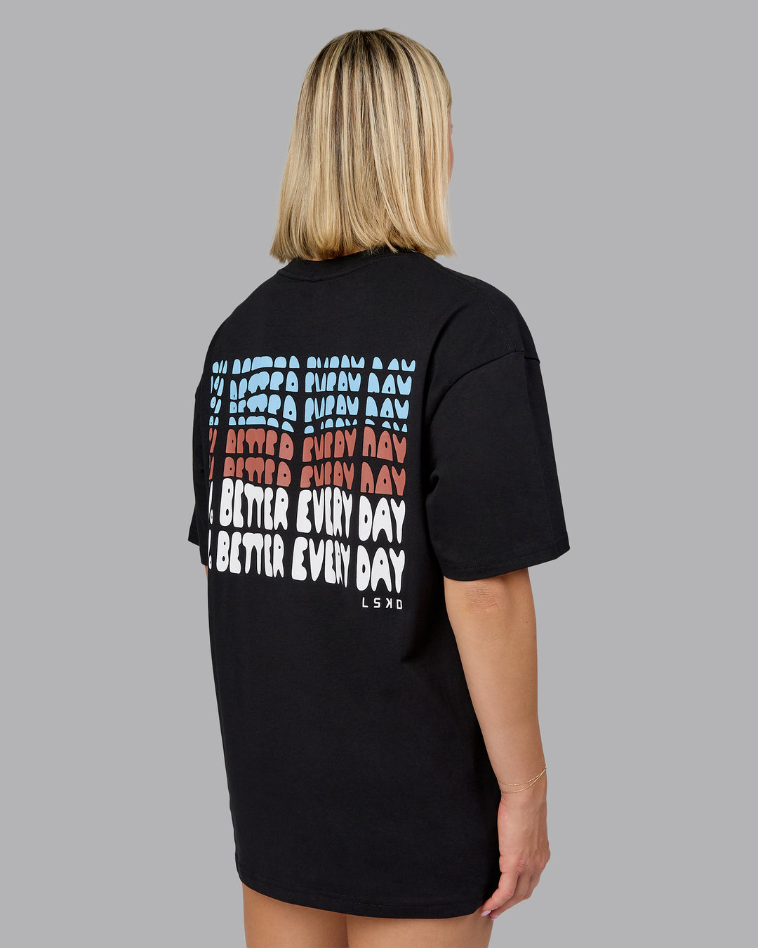Woman wearing On Repeat FLXCotton Oversized Tee - Black-Mahogany | Model:Halle | Size:XS