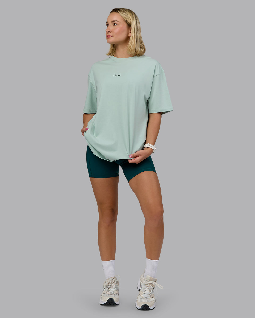 Woman wearing On Repeat FLXCotton Oversized Tee - Blue Haze-Dark Moss | Model:Halle | Size:XS