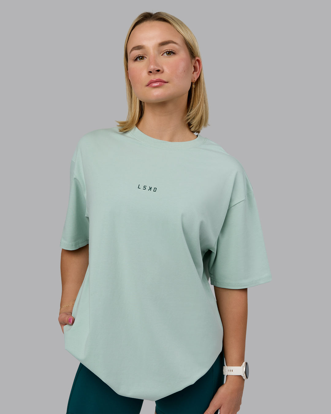 Woman wearing On Repeat FLXCotton Oversized Tee - Blue Haze-Dark Moss | Model:Halle | Size:XS