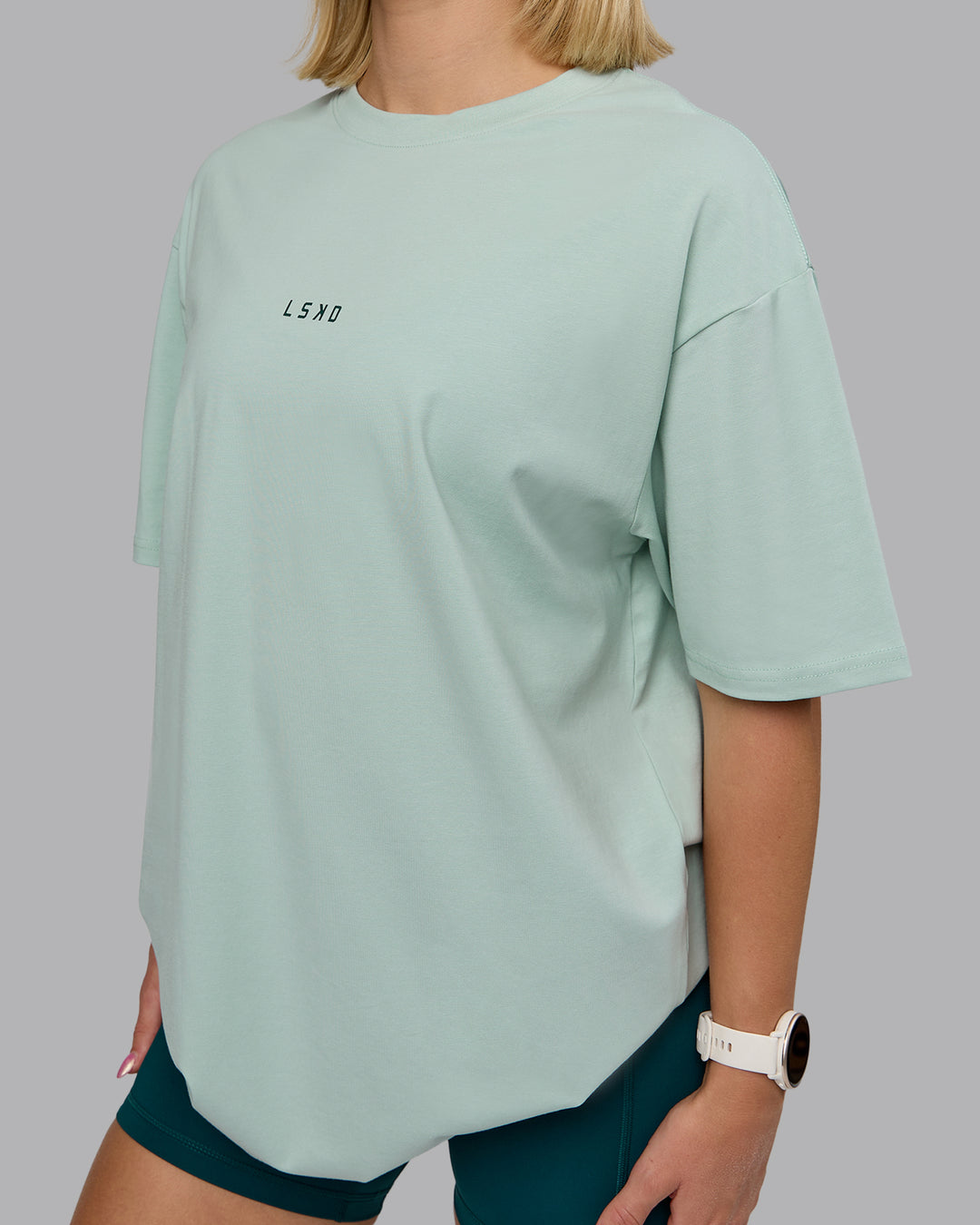 Woman wearing On Repeat FLXCotton Oversized Tee - Blue Haze-Dark Moss | Model:Halle | Size:XS