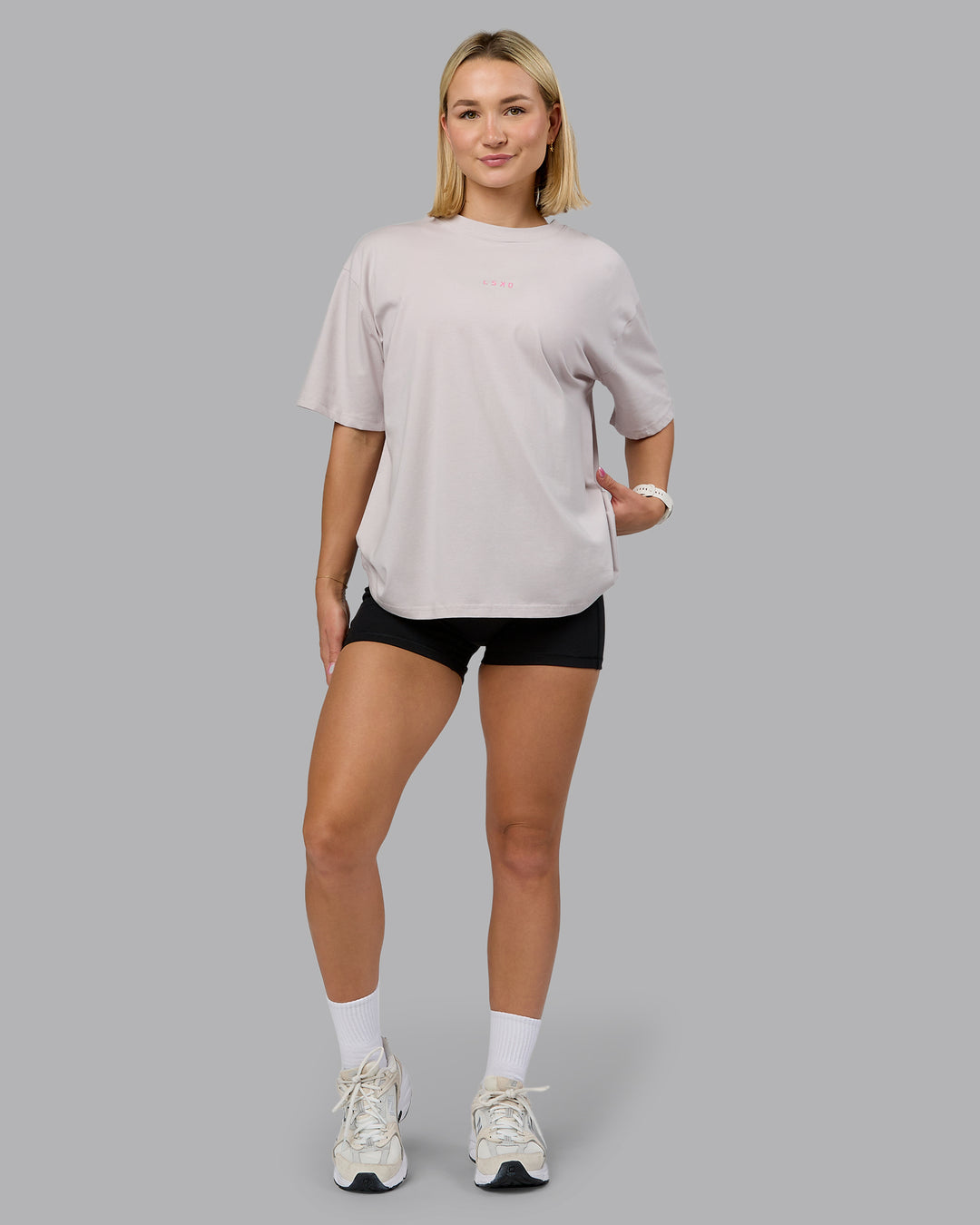 Woman wearing On Repeat FLXCotton Oversized Tee - Soft Grey-Candy Pink | Model:Halle | Size:S