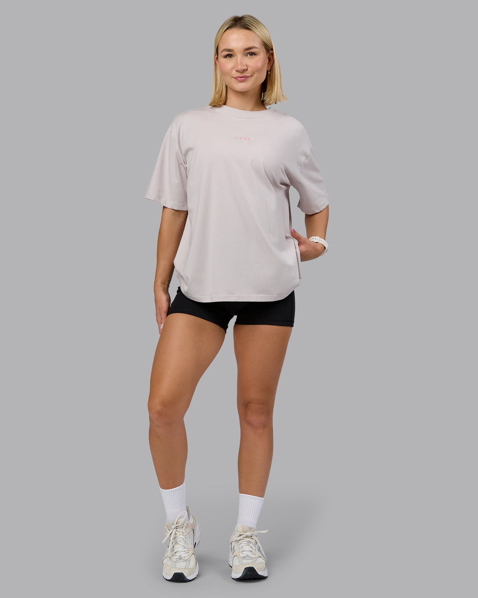 Woman wearing On Repeat FLXCotton Oversized Tee - Soft Grey-Candy Pink | Model:Halle | Size:S