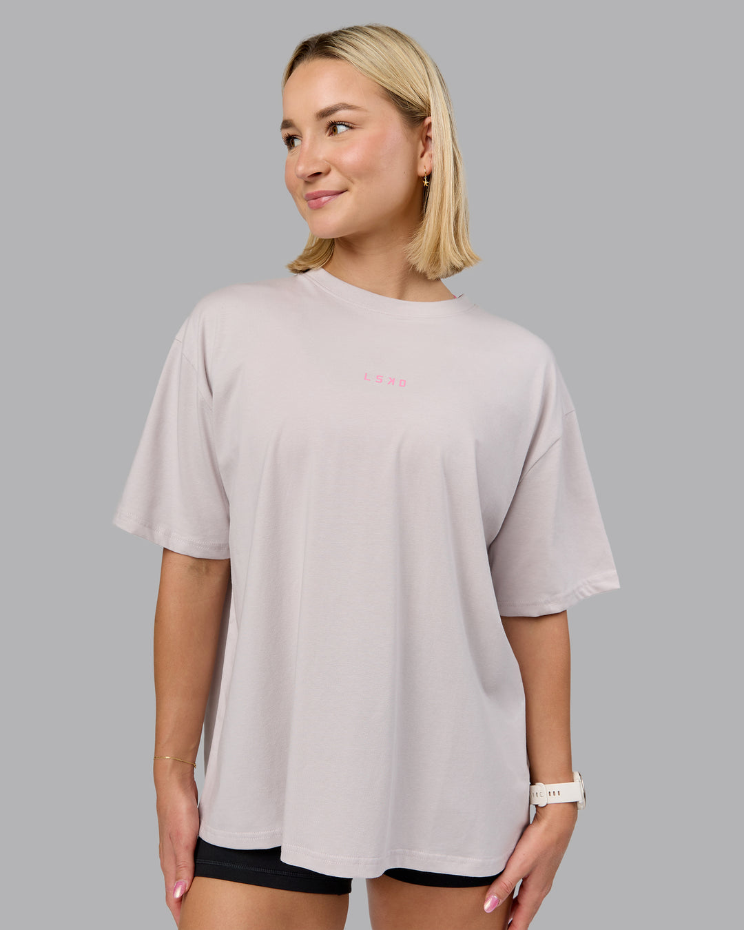 Woman wearing On Repeat FLXCotton Oversized Tee - Soft Grey-Candy Pink | Model:Halle | Size:S