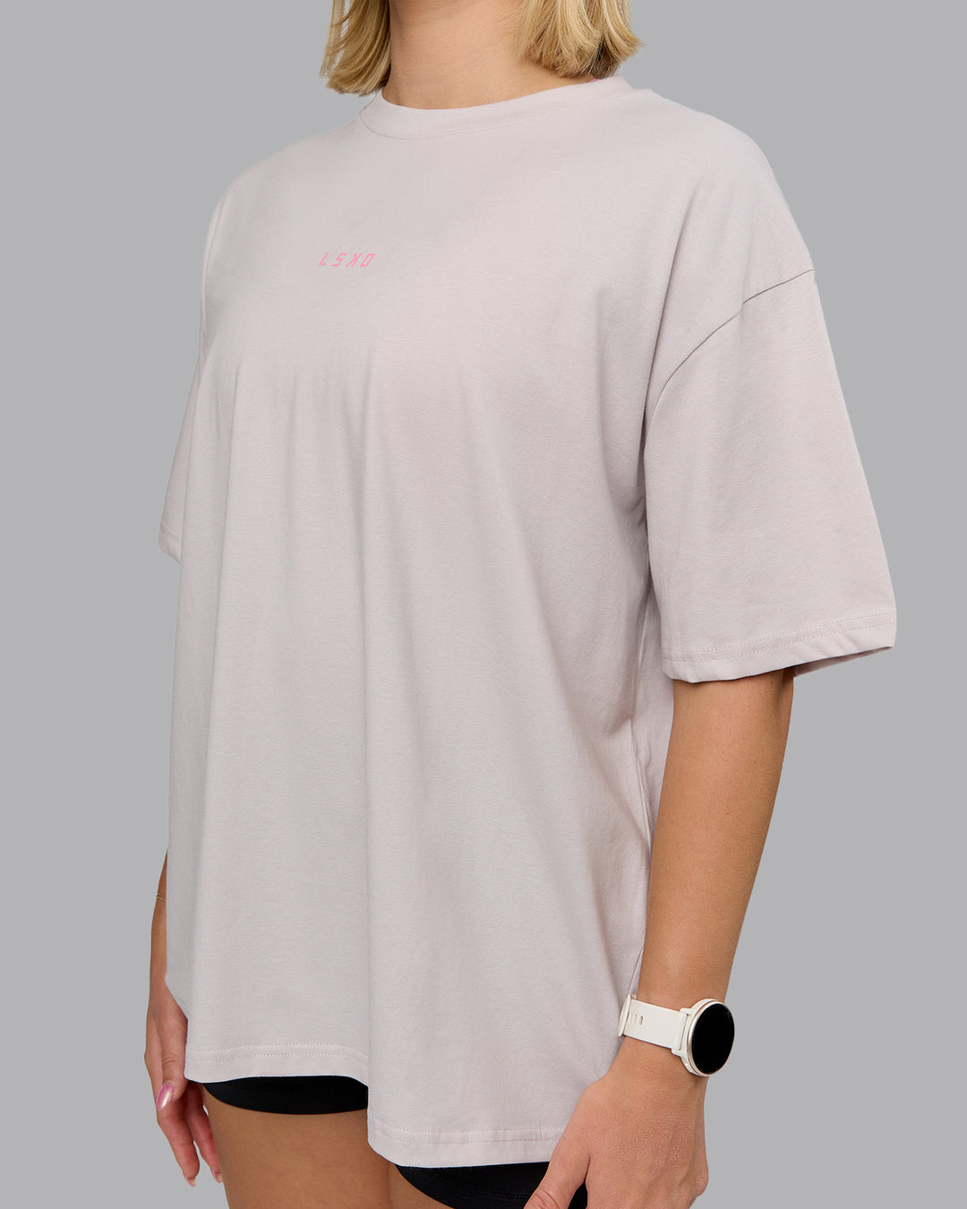 Woman wearing On Repeat FLXCotton Oversized Tee - Soft Grey-Candy Pink | Model:Halle | Size:S