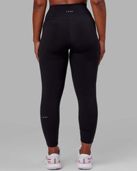 Woman wearing O.G. Fusion Ultra High-Rise Full Length Legging Pockets - Black | Model:Krystal | Size:L