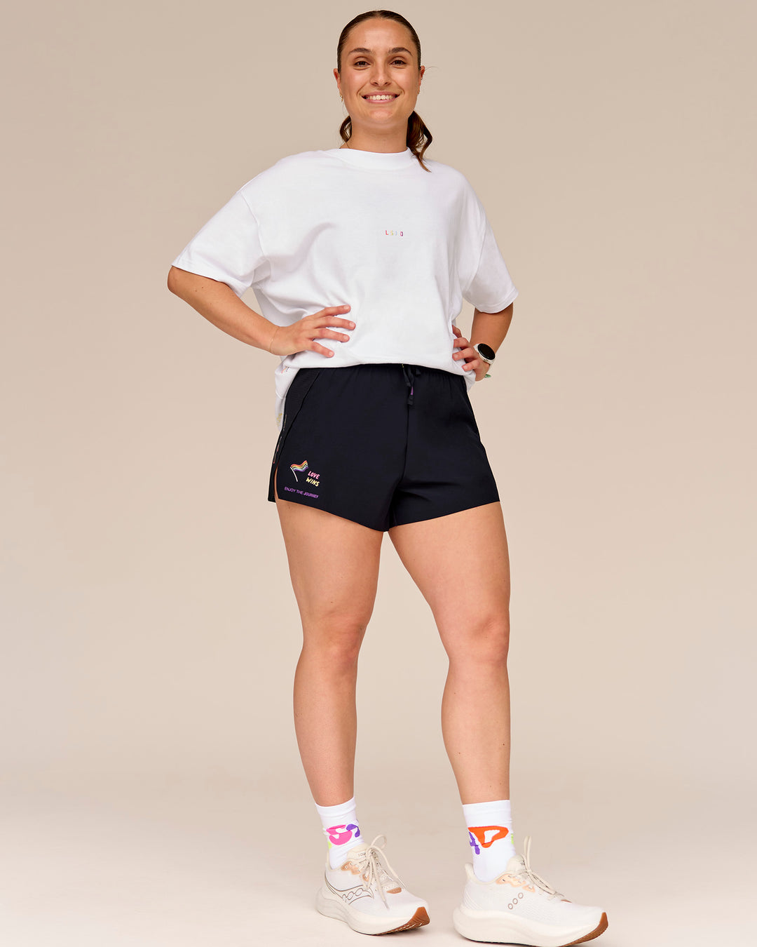 Woman wearing Accelerate 3" High-Rise Running Short - Black-Radiate