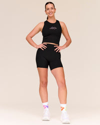 Woman wearing Flow Graphic Performance Tank 2.0 - Black-Radiate | Thumbnail Index: 1