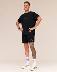 Man wearing Pride Sticker Boxy Tee - Black