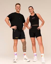Man wearing Pride Rep 7" Training Shorts - Black - Black