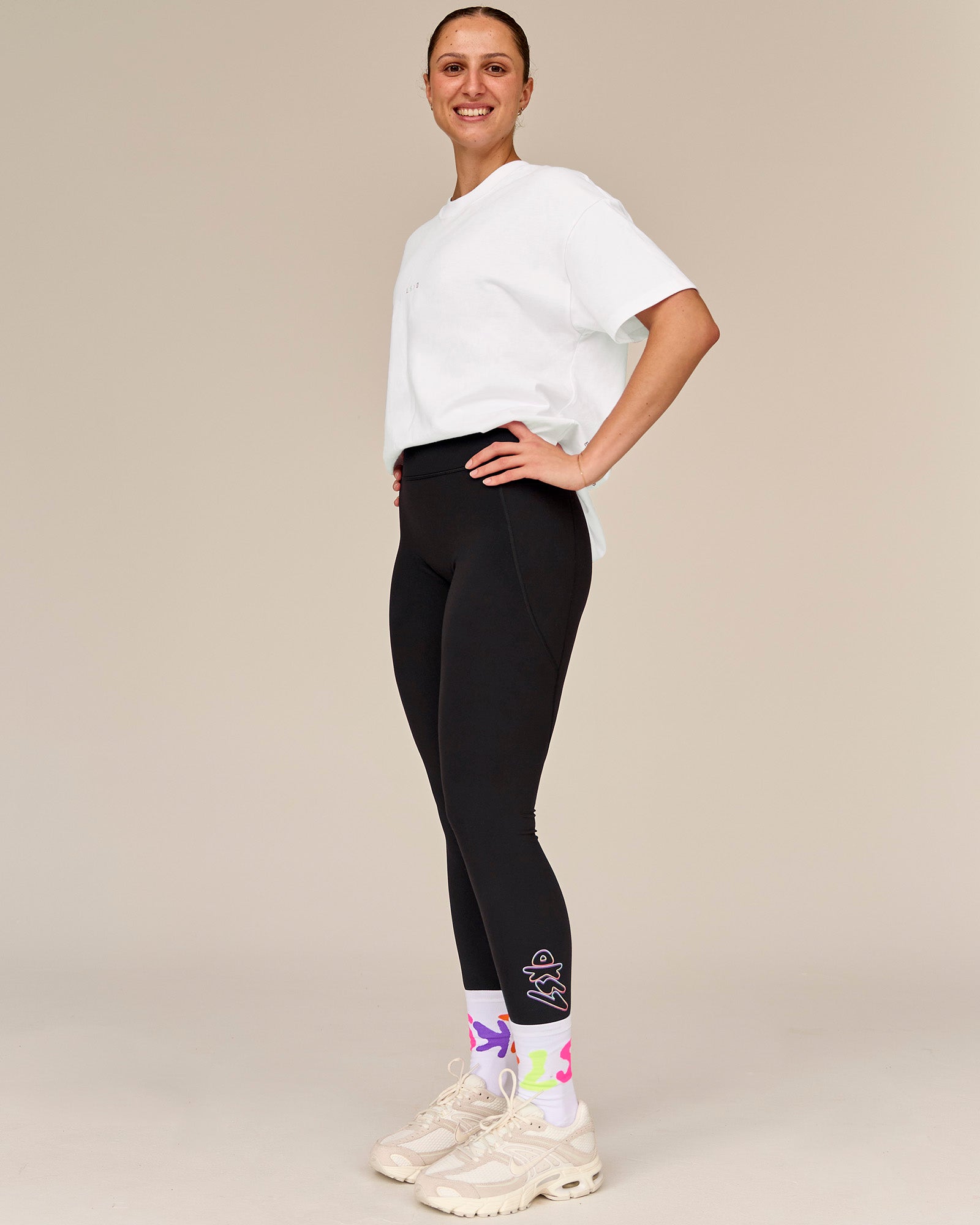 Woman wearing Fusion Graphic Ultra High-Rise Full Length Legging Pockets - Black-Radiate