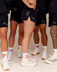Duo wearing Accelerate 3" High-Rise Running Short - Black-Radiate