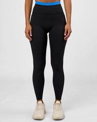 Woman wearing Liberate High-Rise Full Length Legging Pockets - Black-Palace Blue | Model:Brylee | Size:XS | Thumbnail Index: 0