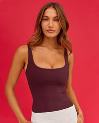 Woman wearing Twist Square Neck Shelf Bra Tank in Cherry Lacquer