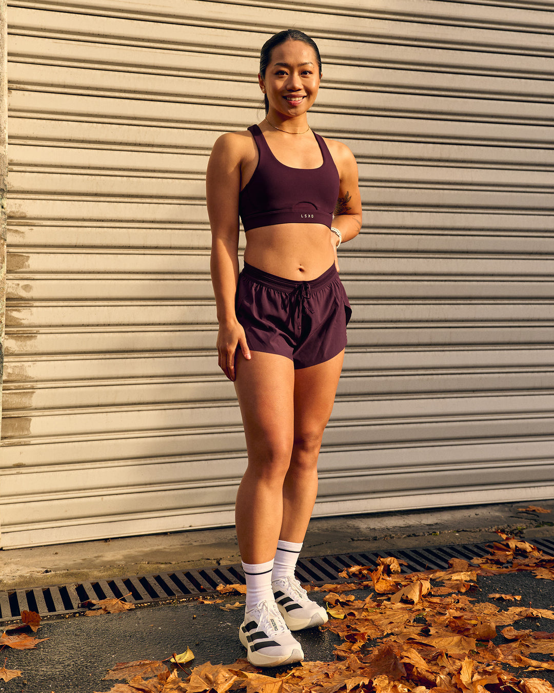 Woman wearing Fast-Track Sports Bra - Cherry Lacquer