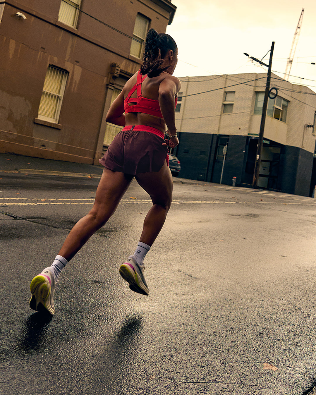 Woman wearing Accelerate 3" Mid-Rise Running Short - Cherry Lacquer-Scarlet