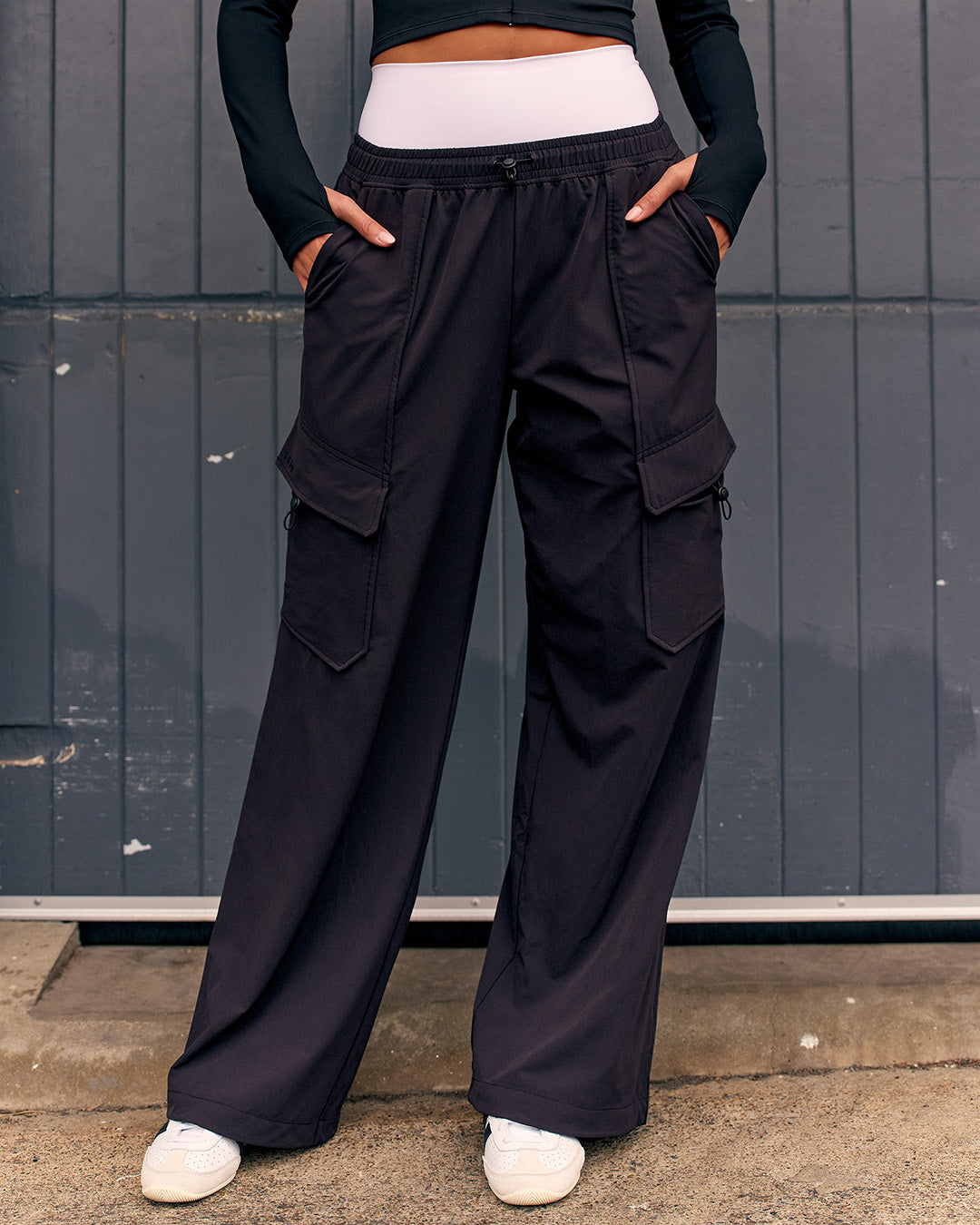 Woman wearing Endeavour Cargo Pant - Black - view 1