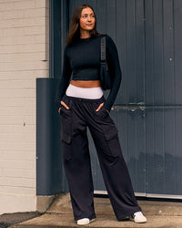 Woman wearing Endeavour Cargo Pant - Black | Thumbnail Index: 3