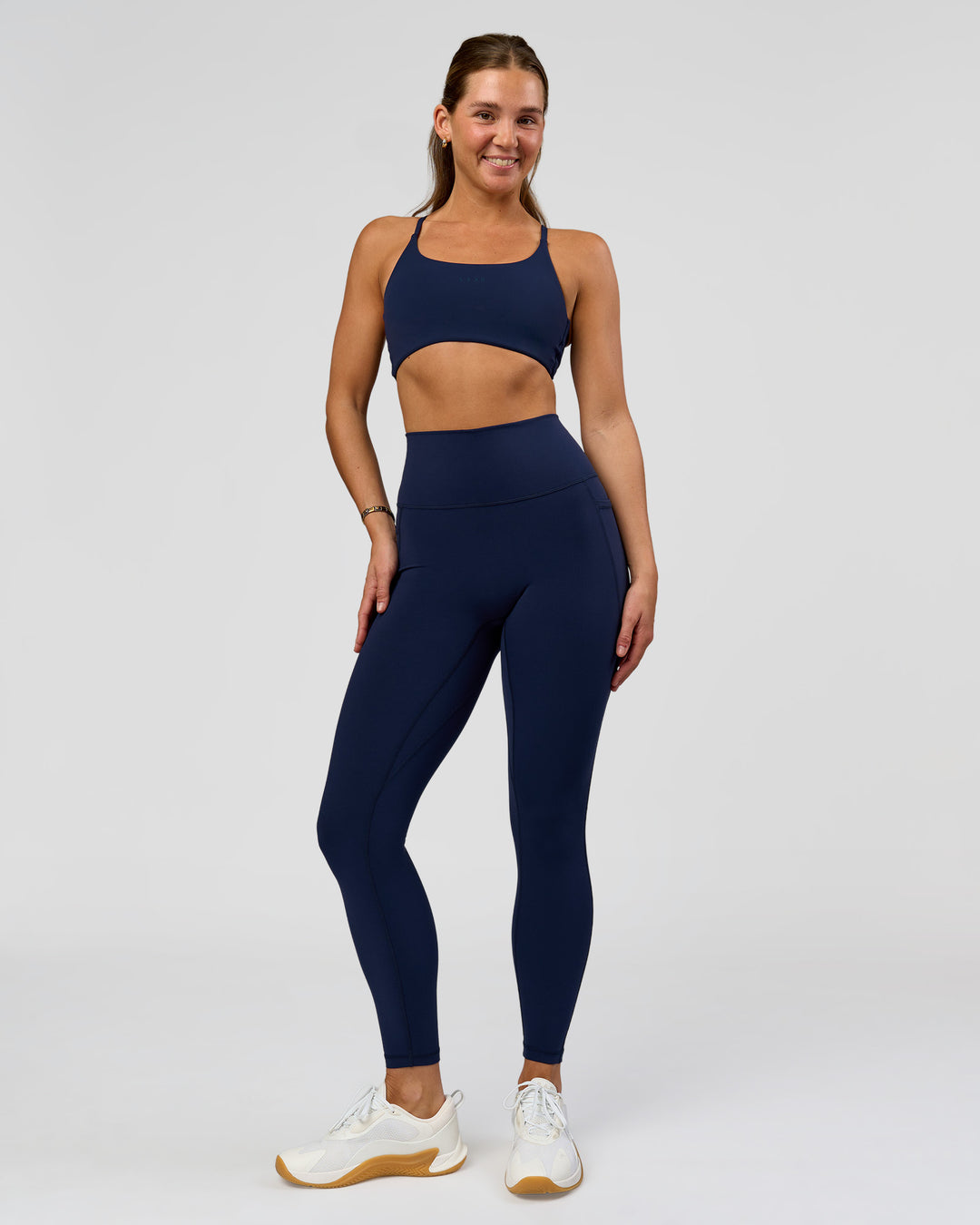Woman wearing O.G. Fusion Ultra High-Rise Full Length Legging Pockets - Future Navy | Model:Amity| Size:S - view 3