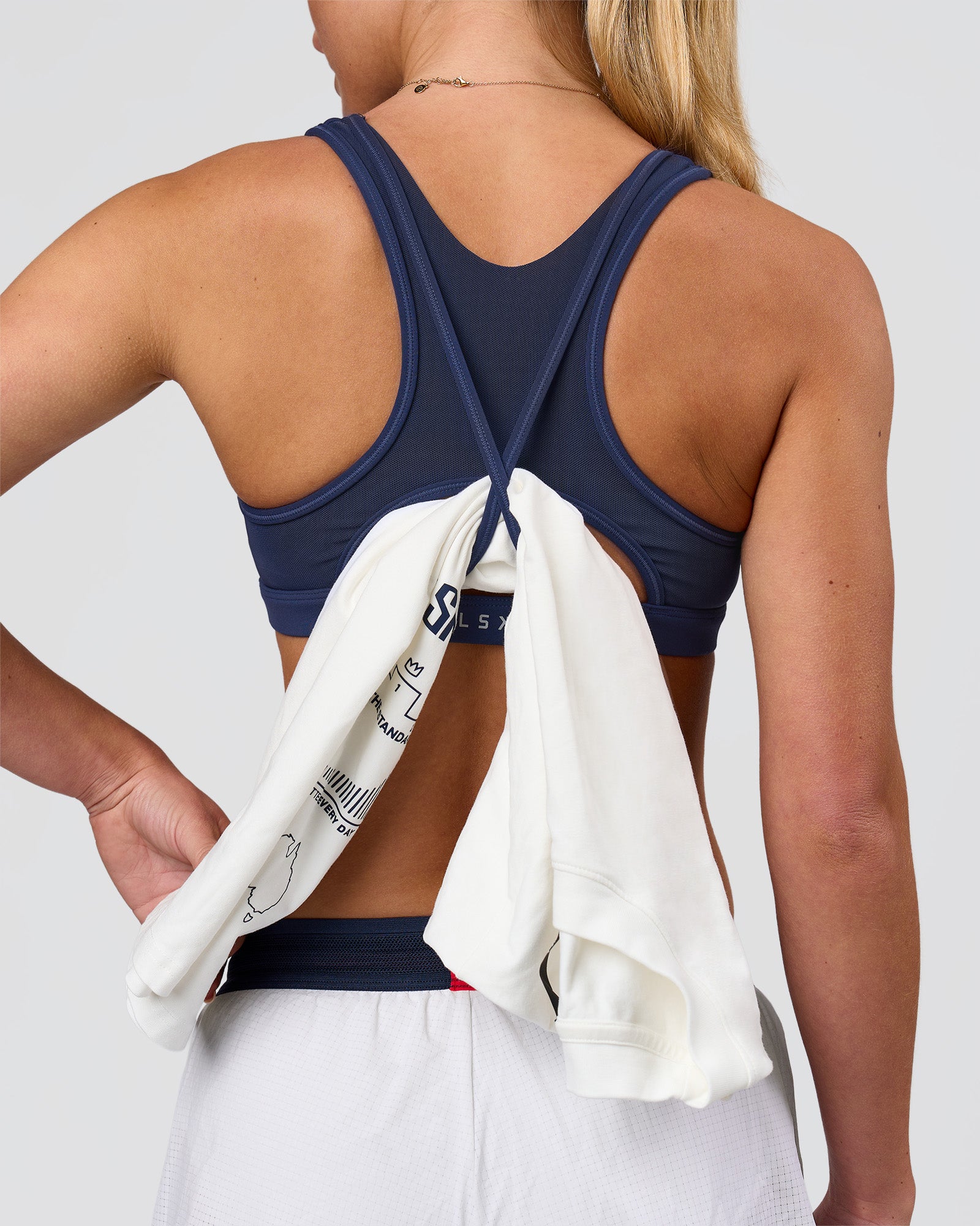 Woman wearing Unstoppable Racerback Sports Bra - Future Navy| Model:Issy| Size:XS