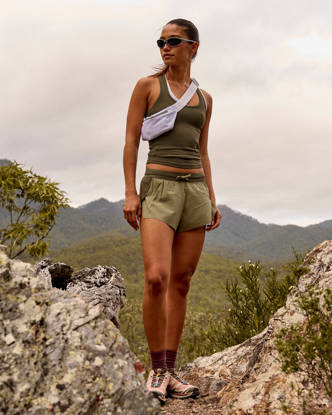 Woman wearing Accelerate 3" Mid-Rise Running Short - Pure Olive-Fog - view 2
