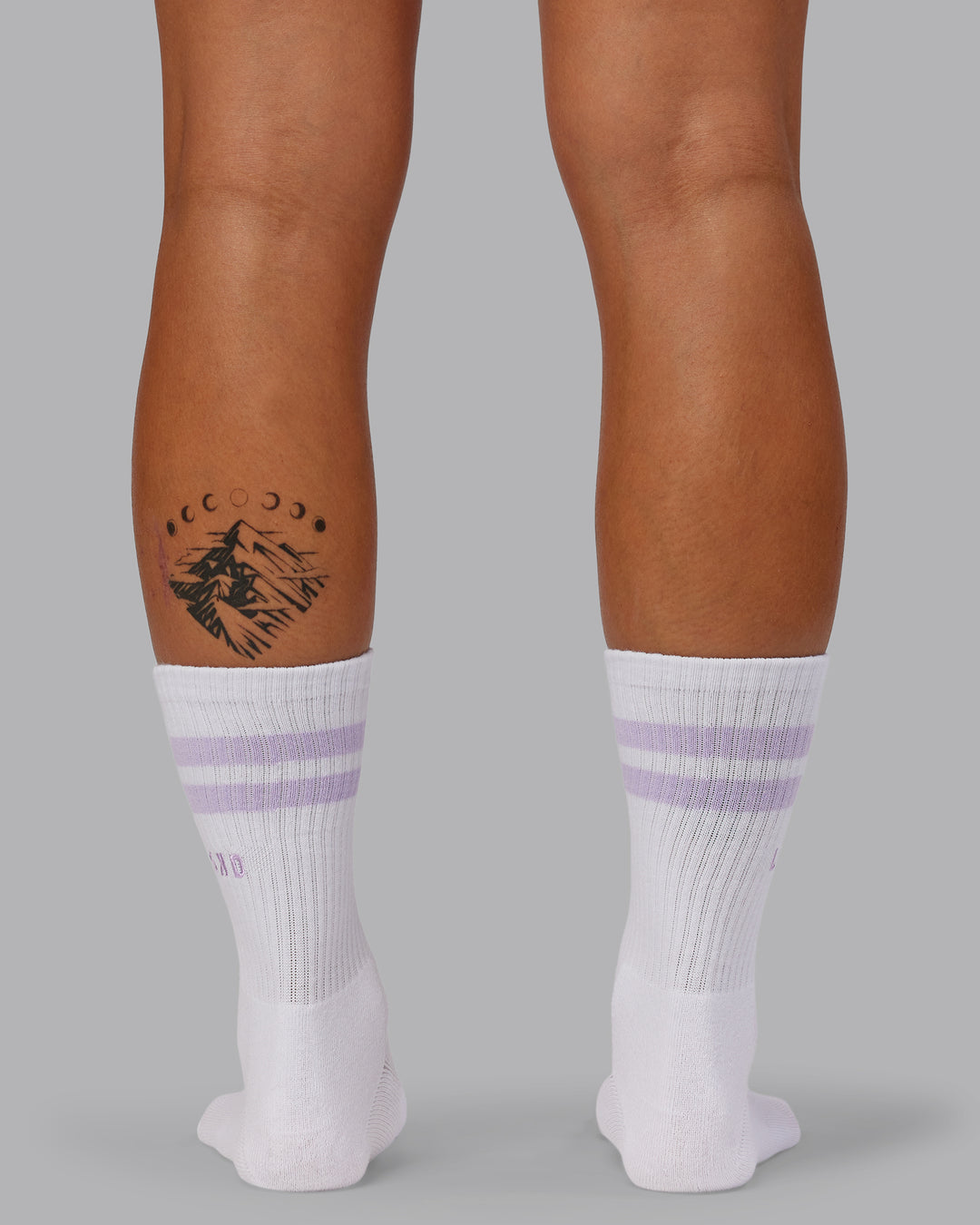 Model wearing Fast-Heritage-Signal Pack - Black/White-Galactic Lilac/Dark Moss Success | Size:OS