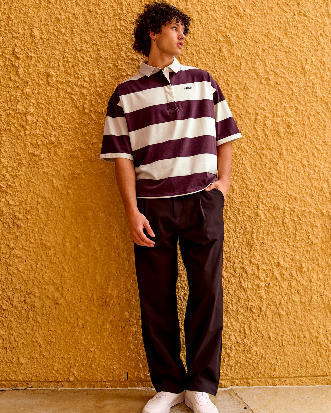 
Man wearing Oversized Rugby Polo - Off White-Cherry | Model:Malebo | Size:M