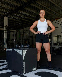 Woman wearing Flow Performance Tank - White