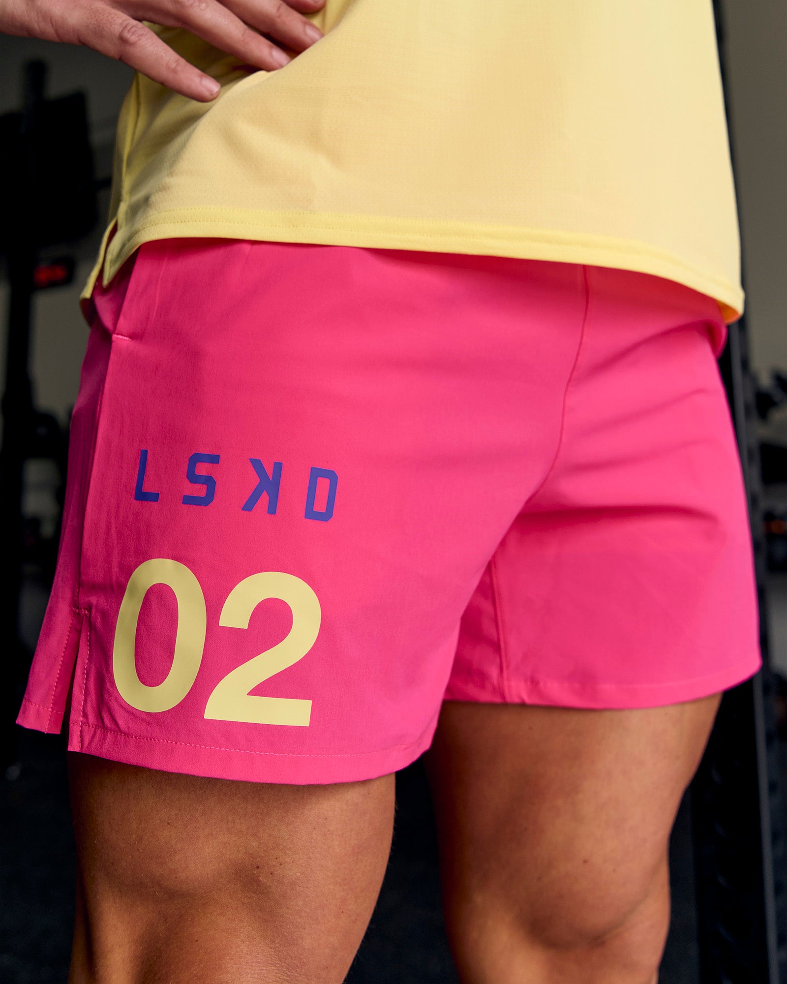 Man wearing Pace 5" Lined Running Short - Game Plan Ultra Pink