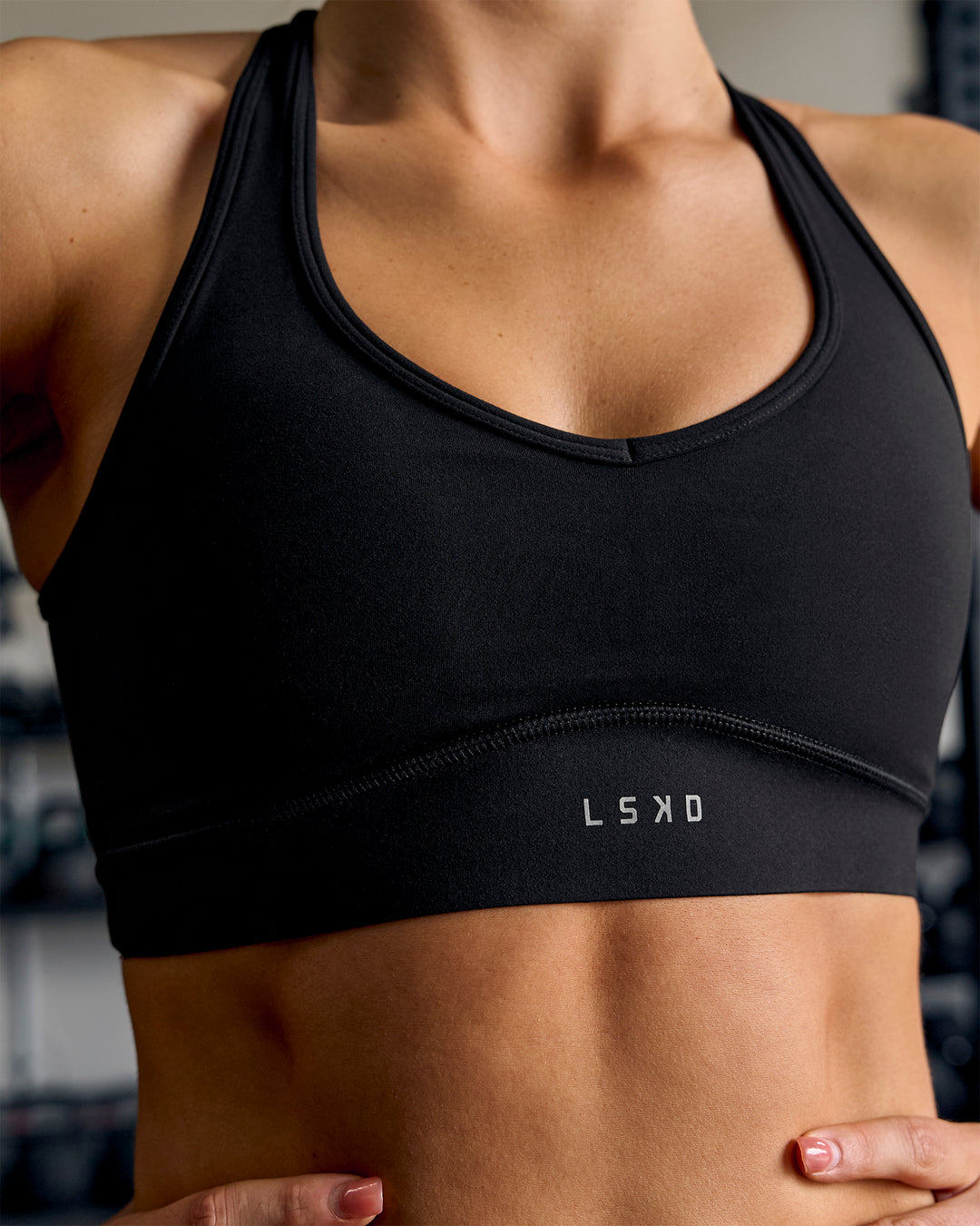 Woman wearing Stamina Amplify Sports Bra - Black - view 10