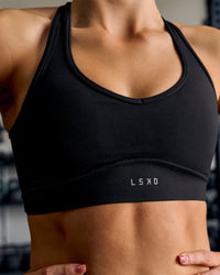 Woman wearing Stamina Amplify Sports Bra - Black | Thumbnail Index: 9