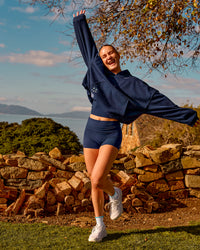 Woman wearing Groovy High Rise Fold Over 4" Short - Future Navy | Model:Brianna | Size:XS