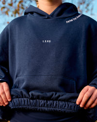 Woman wearing Zola Oversized Hoodie - Future Navy | Model:Brianna | Size:M