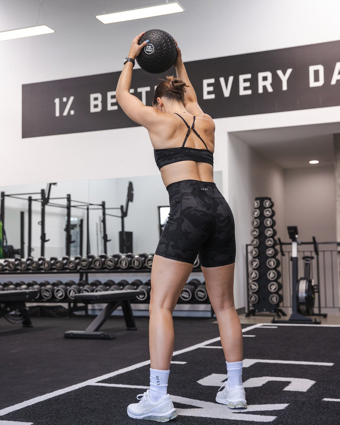 Woman wearing Fusion Ultra High-Rise 6&quot; Short Pockets - Black Camo | Model:Abbey | Size:S