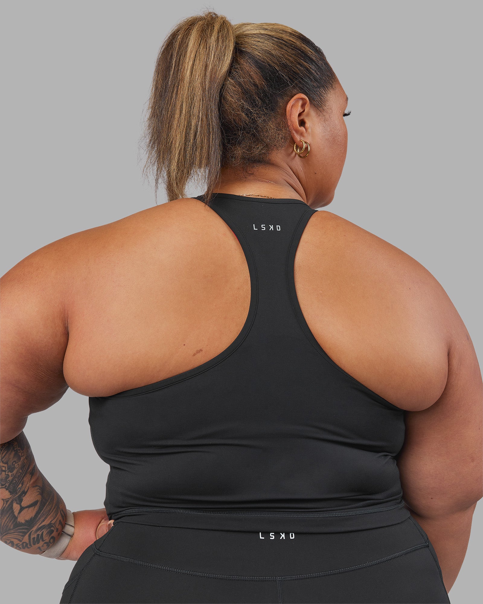 Woman wearing Be Bold Performance Tank - Black | Model:Lilz | Size:2XL