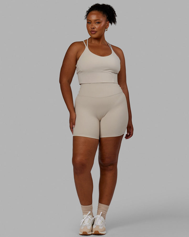 Woman wearing Empower Corset Bra - Shale Beige
