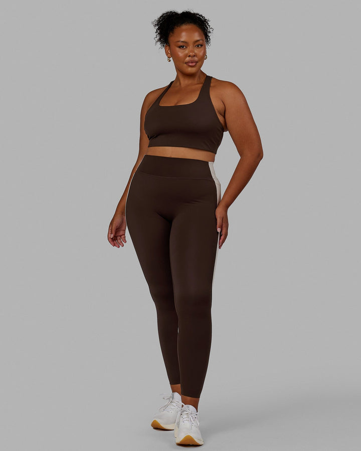 Woman wearing Evolve Full Length Tights - Dark Chocolate