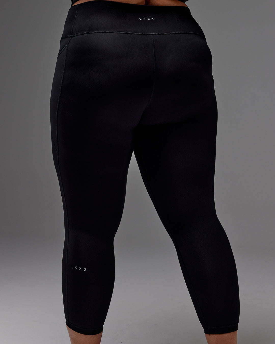 Woman wearing Fusion Ultra High-Rise 7/8 Legging Pockets - Black | Model:Jordie | Size:2XL