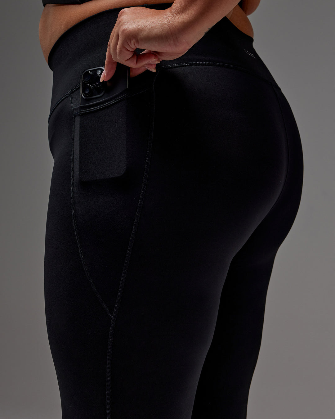 Woman wearing Fusion Ultra High-Rise 7/8 Legging Pockets - Black | Model:Jordie | Size:2XL