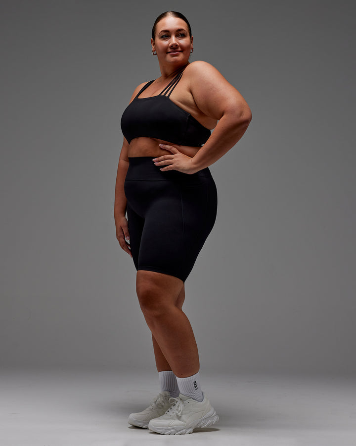 Woman wearing Fusion Bike Short With Pockets in Black | Model:Jordie | Size:2XL
