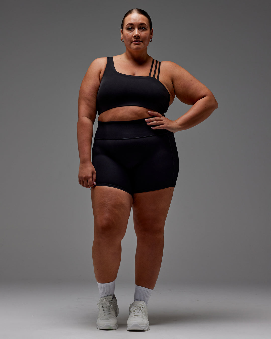 Woman wearing Fusion Ultra High-Rise 6&quot; Short Pockets - Black | Model:Jordie | Size:2XL