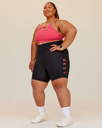 Woman wearing Rep Ultra High-Rise 6" Short Pockets - Black-Bright Raspberry | Model:Lilz | Size:3XL