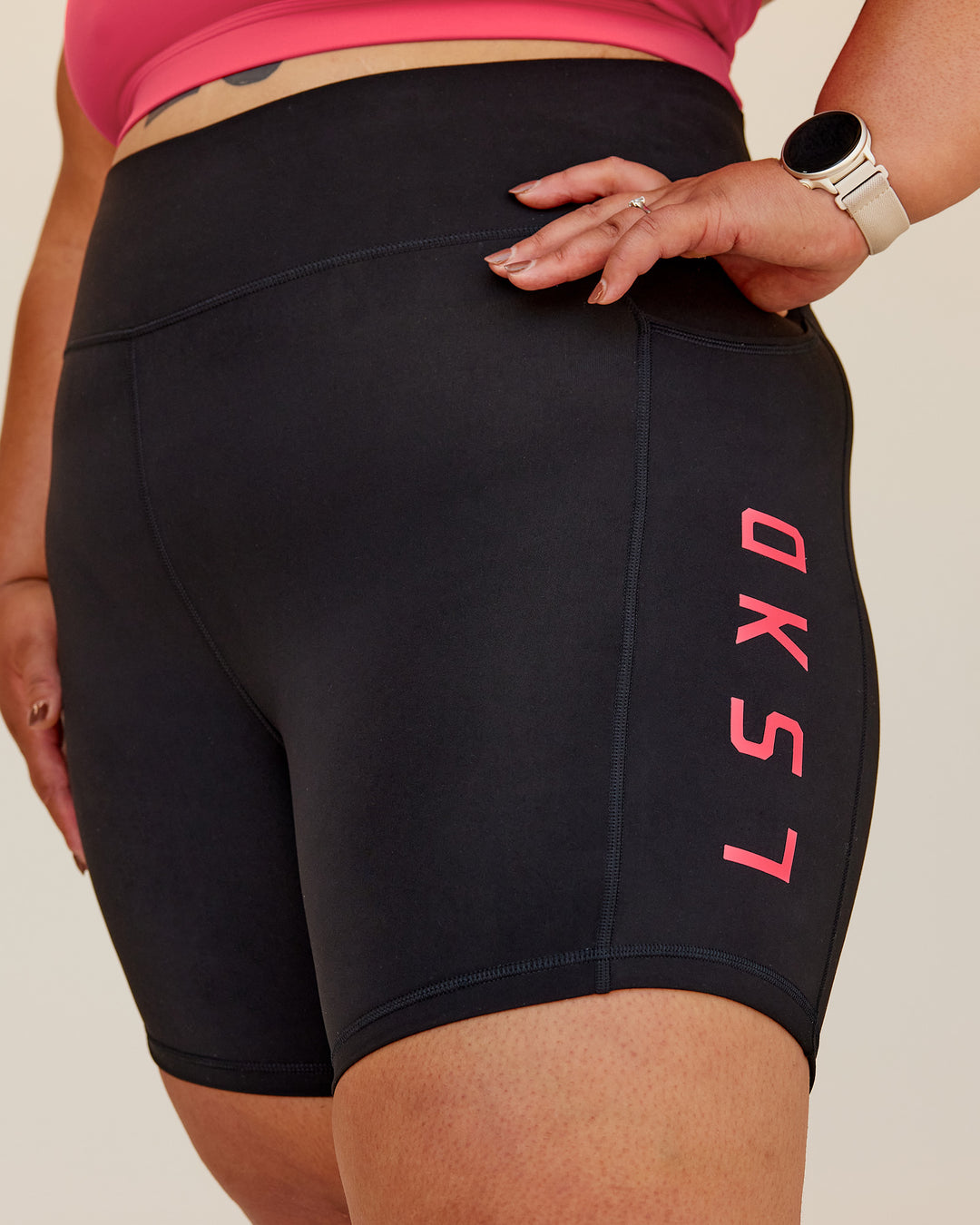 Woman wearing Rep Ultra High-Rise 6" Short Pockets - Black-Bright Raspberry | Model:Lilz | Size:3XL