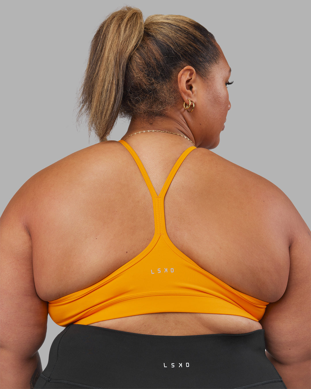 Woman wearing Be Bold Sports Bra - Zinnia | Model:Lilz | Size:3XL