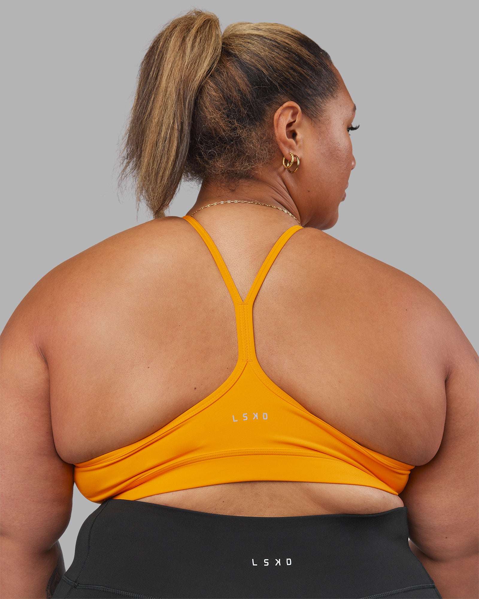 Woman wearing Be Bold Sports Bra - Zinnia | Model:Lilz | Size:3XL